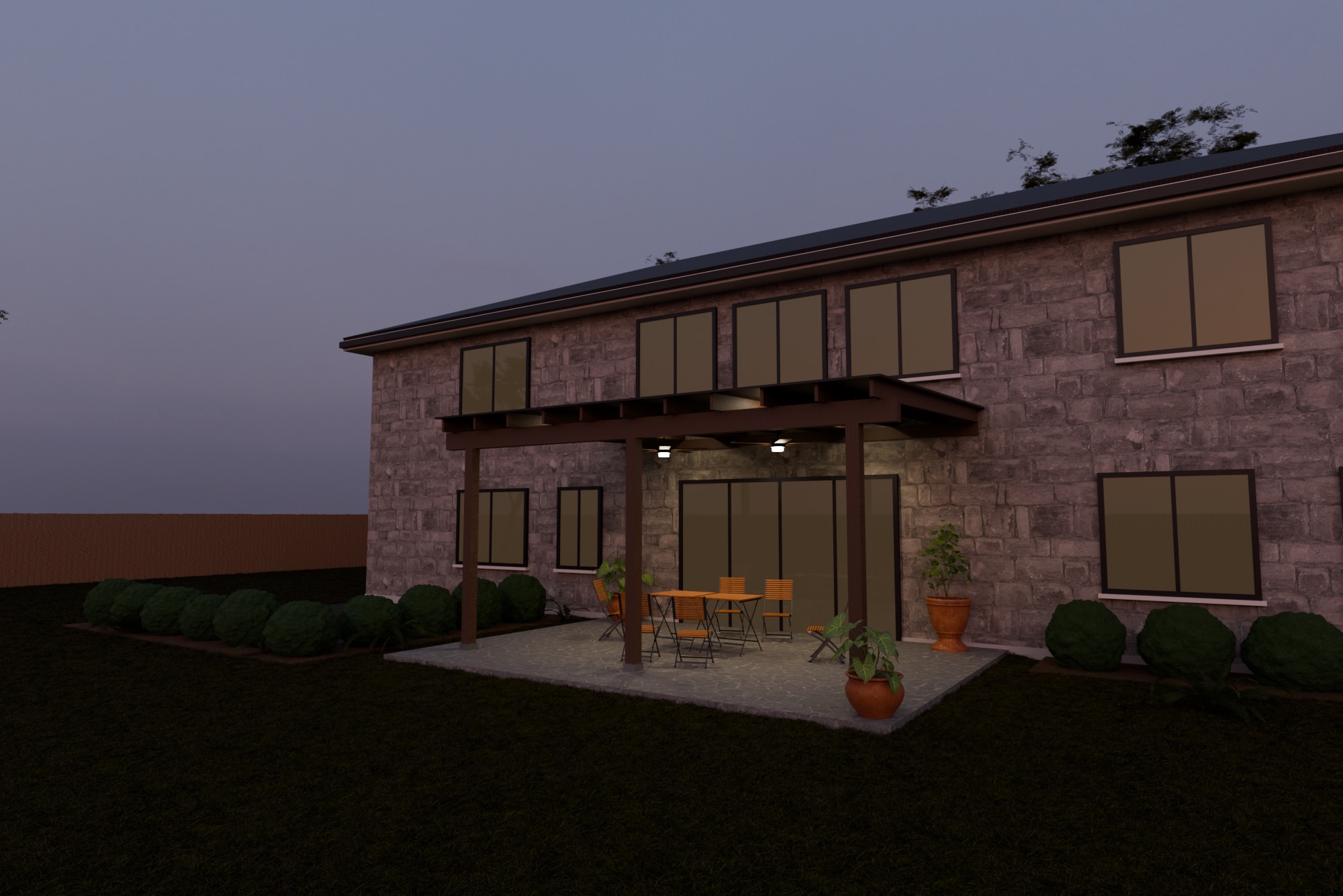 Two-story limestone house at dusk with a walnut-stained patio cover